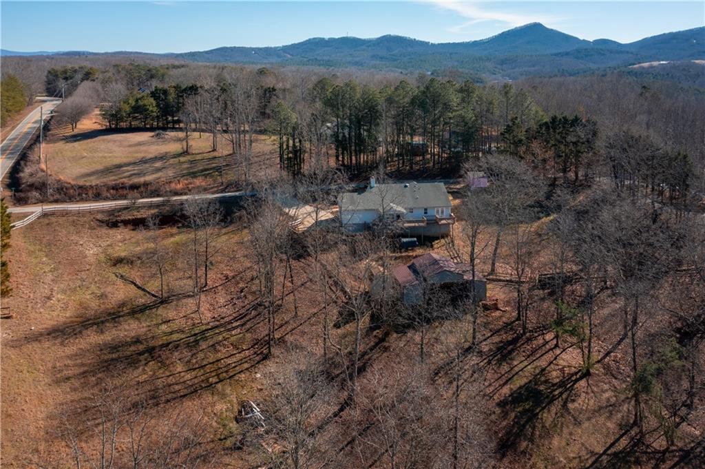 a view of a town with mountains in the background