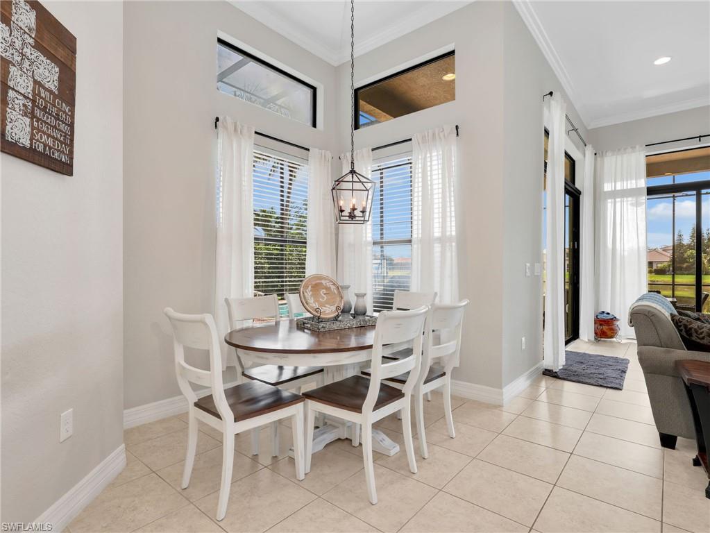 2756 Crystal Way Naples, FL 34119 - Photo 24 of 50 a dining room with furniture and window