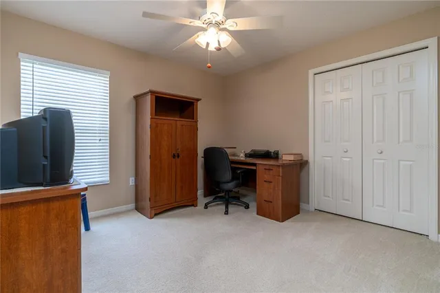 a view of workspace with furniture and natural light