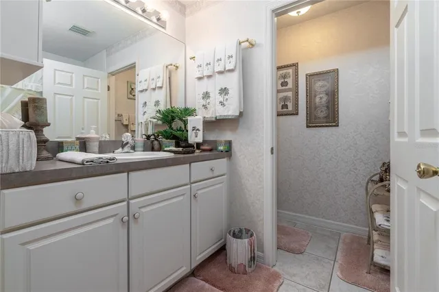 a view of a dining room with furniture wooden floor and a chandelier
