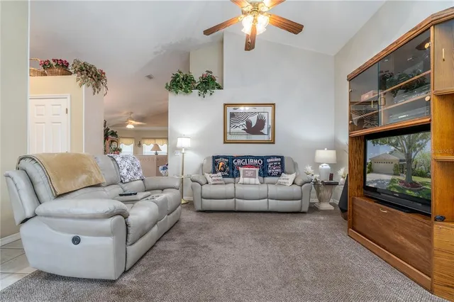 a kitchen with stainless steel appliances kitchen island granite countertop a sink and cabinets