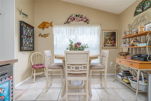 a bedroom with furniture and large windows