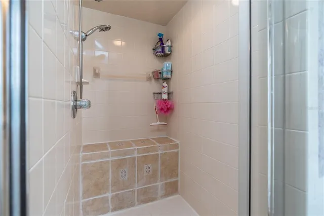 a en suite bathroom with a sink a vanity and a mirror