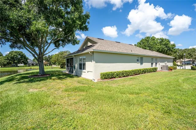 an aerial view of a house with a lake view