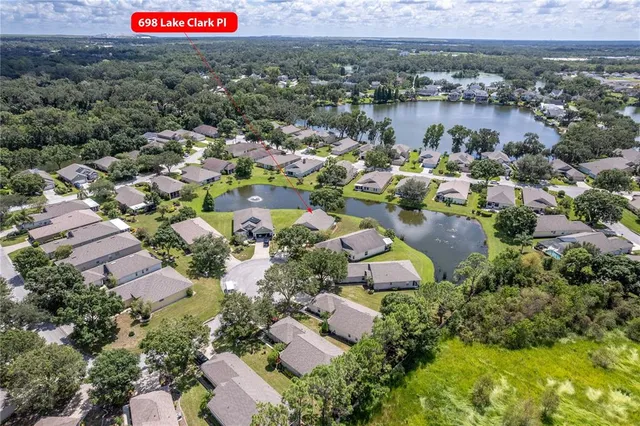 an aerial view of residential house with outdoor space and parking