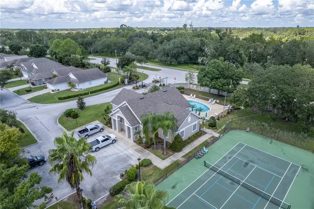 an aerial view of house with a yard