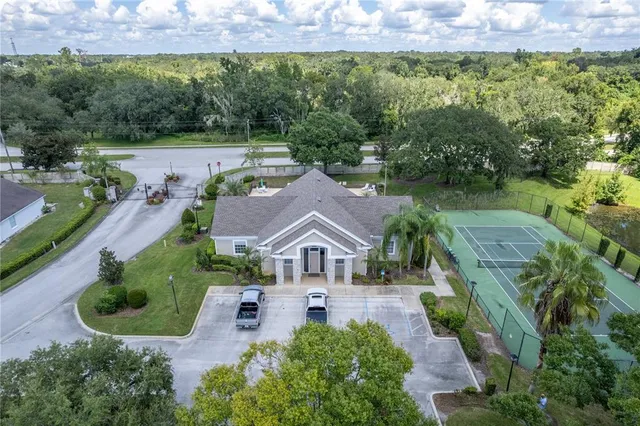 an aerial view of a house with outdoor space