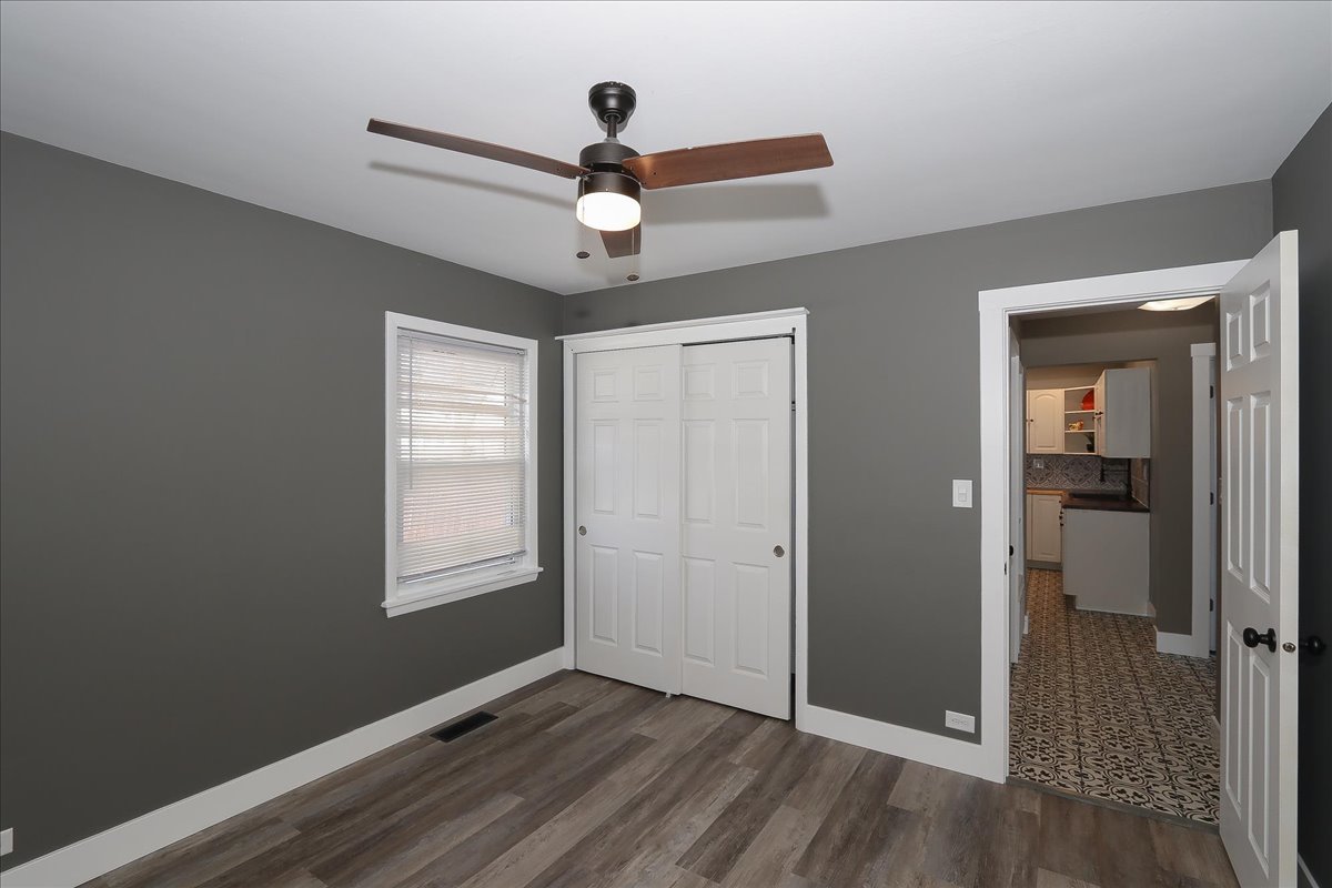 750 East Maple Street, Unit A Lombard, IL 60148 - Photo 14 of 26 a view of an empty room with wooden floor and a window