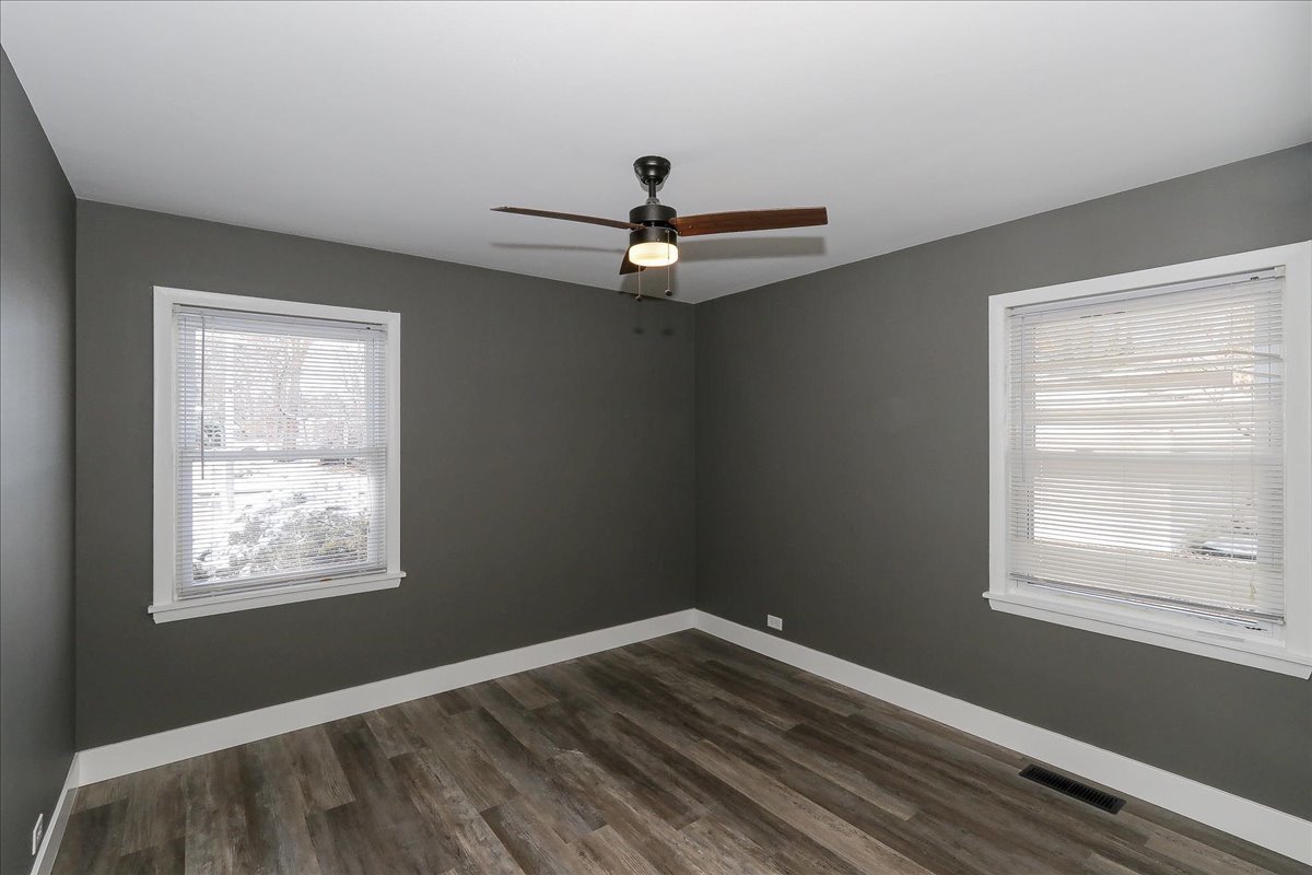 750 East Maple Street, Unit A Lombard, IL 60148 - Photo 15 of 26 a view of empty room with wooden floor and fan