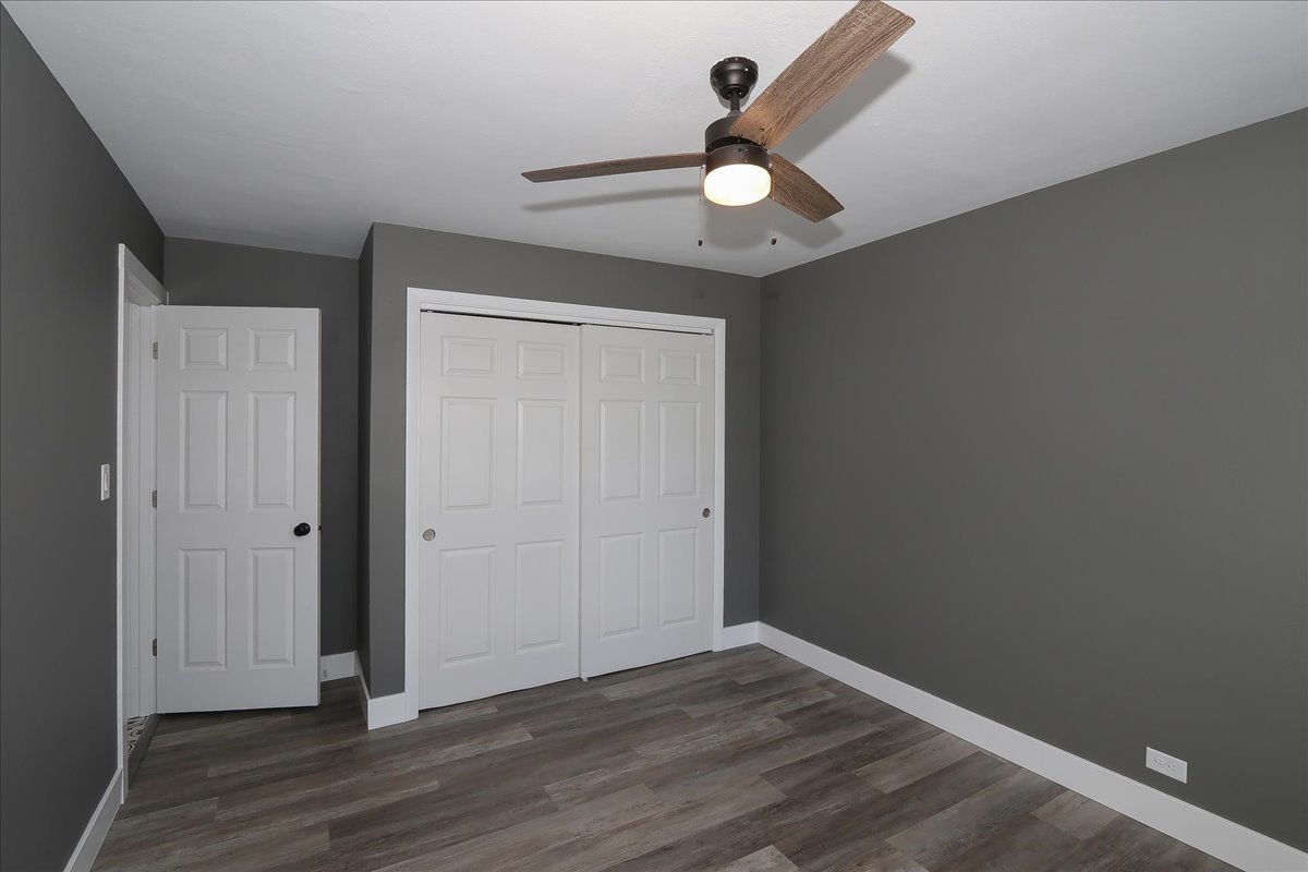 750 East Maple Street, Unit A Lombard, IL 60148 - Photo 18 of 26 an empty room with wooden floor and windows
