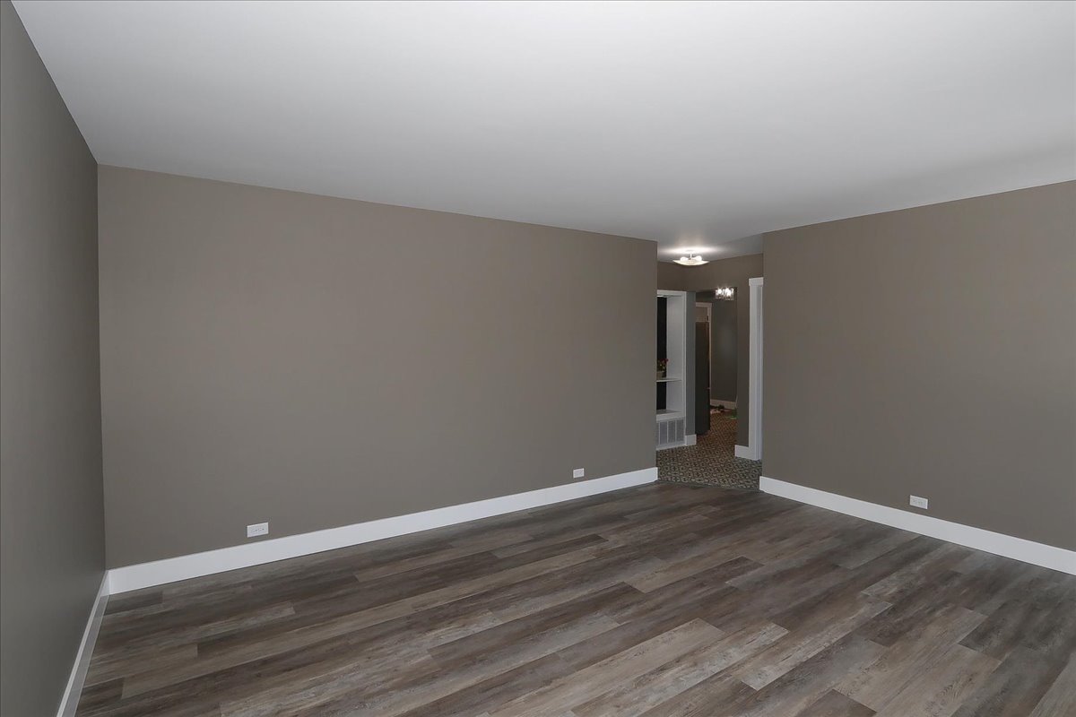 750 East Maple Street, Unit A Lombard, IL 60148 - Photo 6 of 26 a view of room with wooden floor