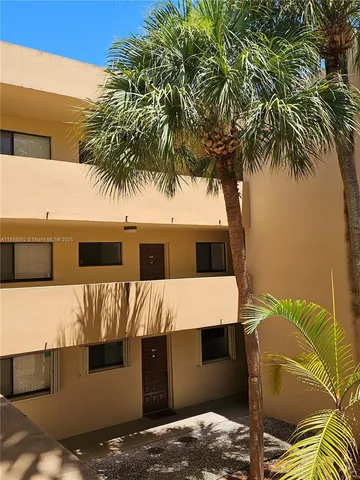 a terrace with a table and chairs