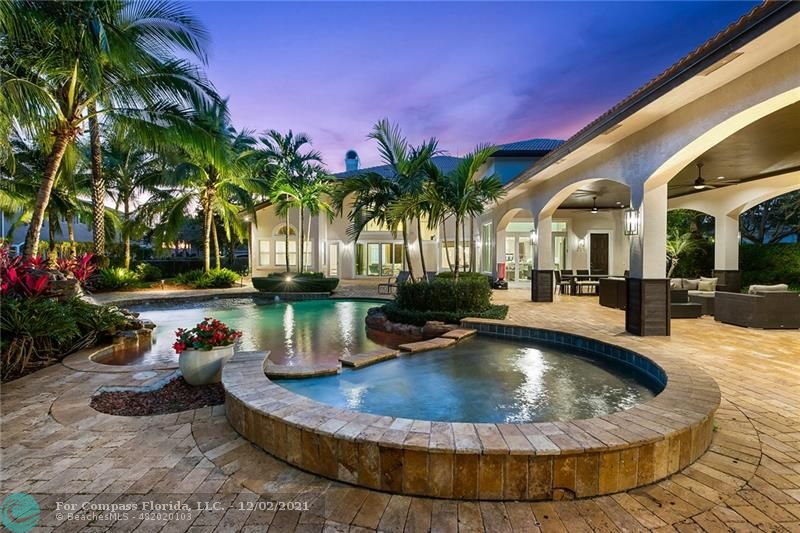 a view of a swimming pool with a patio