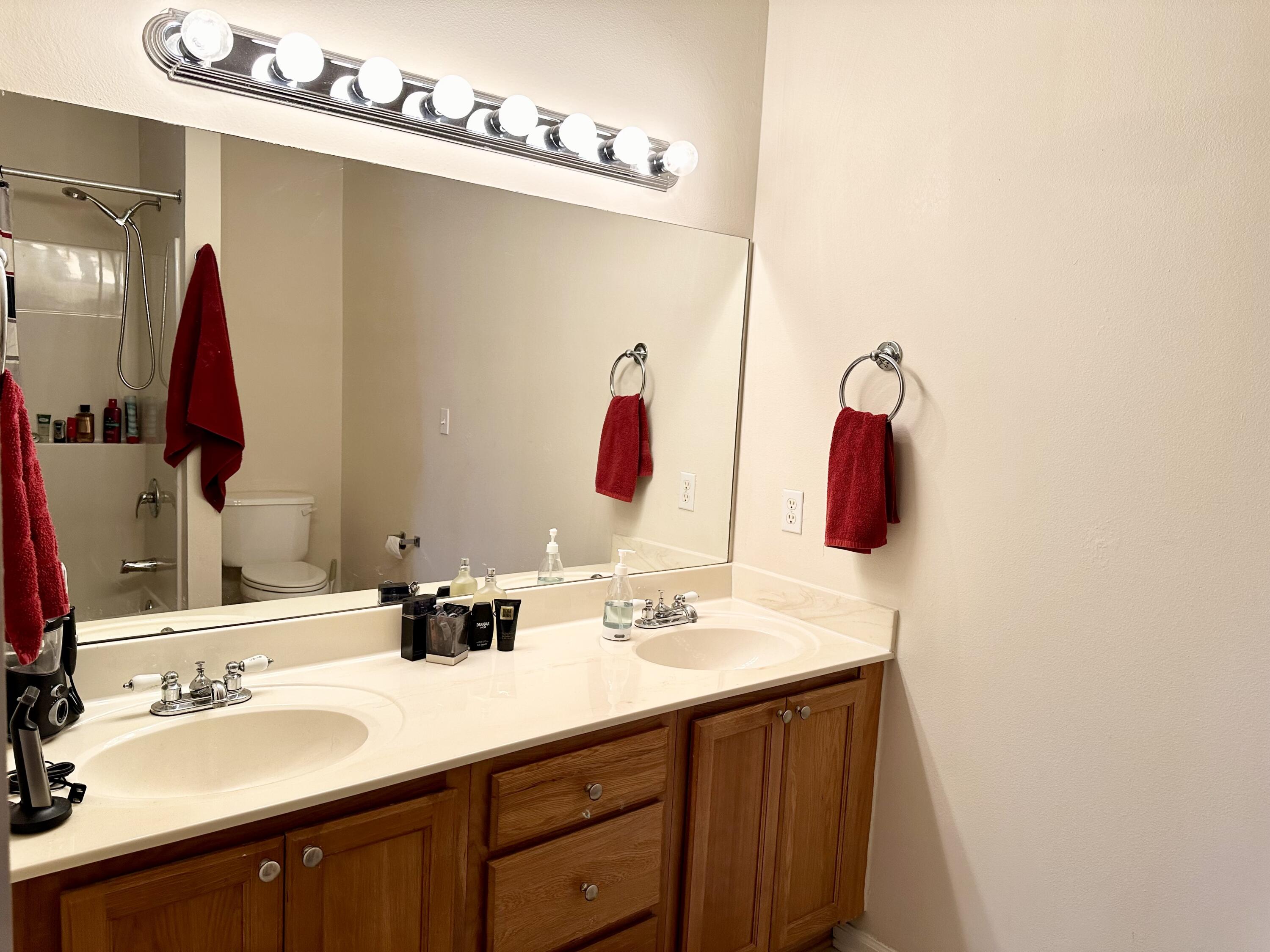 732 East Mack Bayou Drive, Unit 2 Santa Rosa Beach, FL 32459 - Photo 26 of 43 a bathroom with a double vanity sink and a mirror