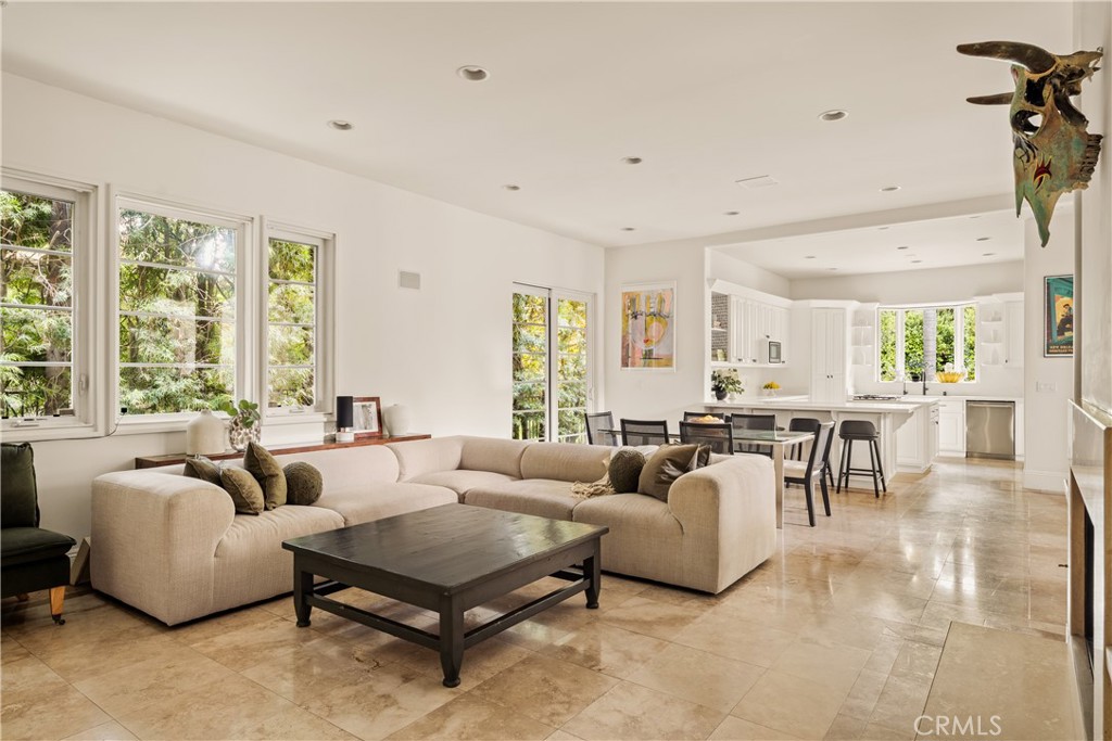4210 Old Topanga Canyon Road Calabasas, CA 91302 - Photo 15 of 40 a living room with furniture potted plant and a large window