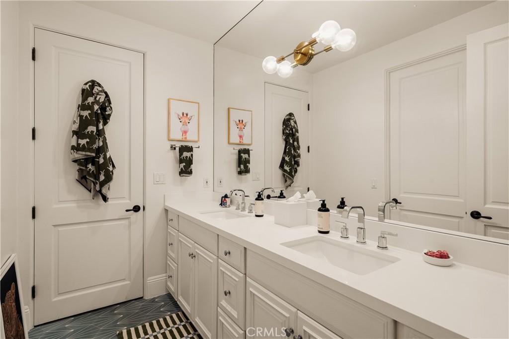 4210 Old Topanga Canyon Road Calabasas, CA 91302 - Photo 17 of 40 a bathroom with a sink a mirror and a shower