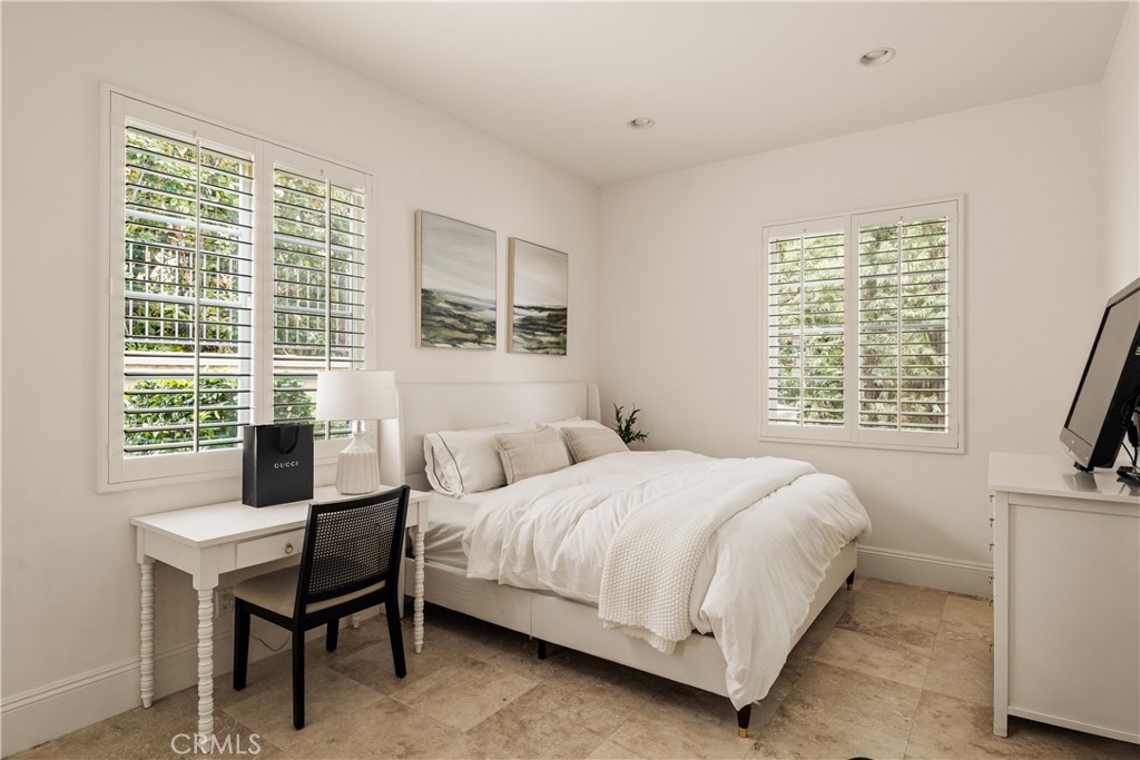 4210 Old Topanga Canyon Road Calabasas, CA 91302 - Photo 20 of 40 a bedroom with a bed and a flat screen tv