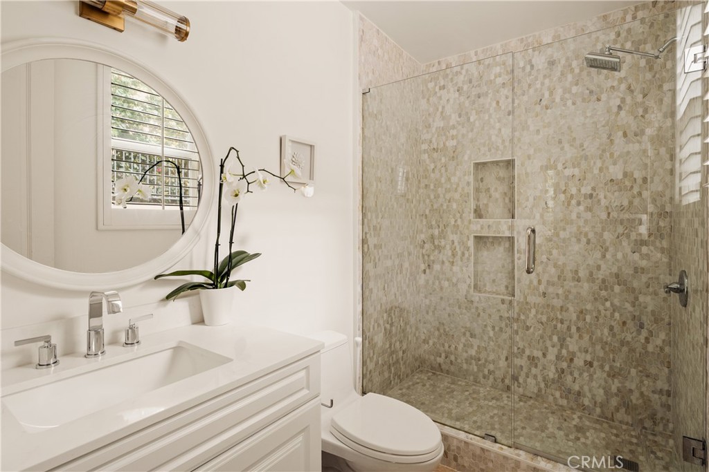 4210 Old Topanga Canyon Road Calabasas, CA 91302 - Photo 21 of 40 a bathroom with a sink a toilet and shower