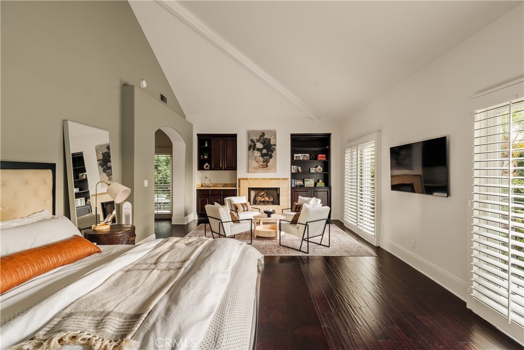 4210 Old Topanga Canyon Road Calabasas, CA 91302 - Photo 25 of 40 a spacious bedroom with a bed and a flat screen tv