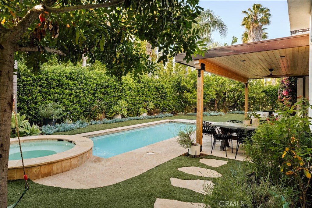 4210 Old Topanga Canyon Road Calabasas, CA 91302 - Photo 29 of 40 a swimming pool with outdoor seating and yard