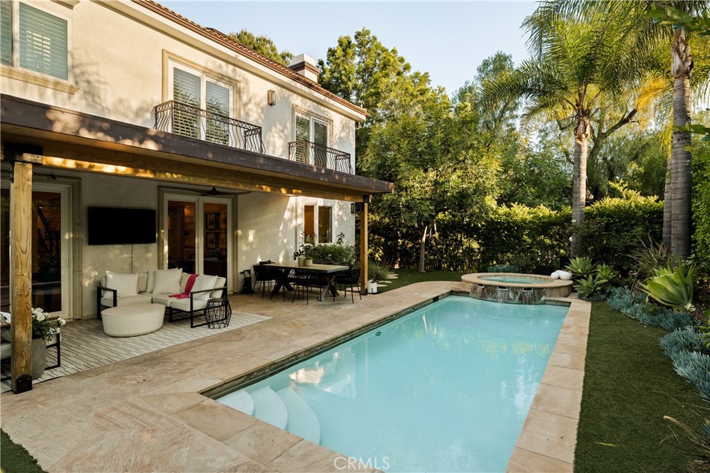 4210 Old Topanga Canyon Road Calabasas, CA 91302 - Photo 32 of 40 a view of a swimming pool with chairs in patio