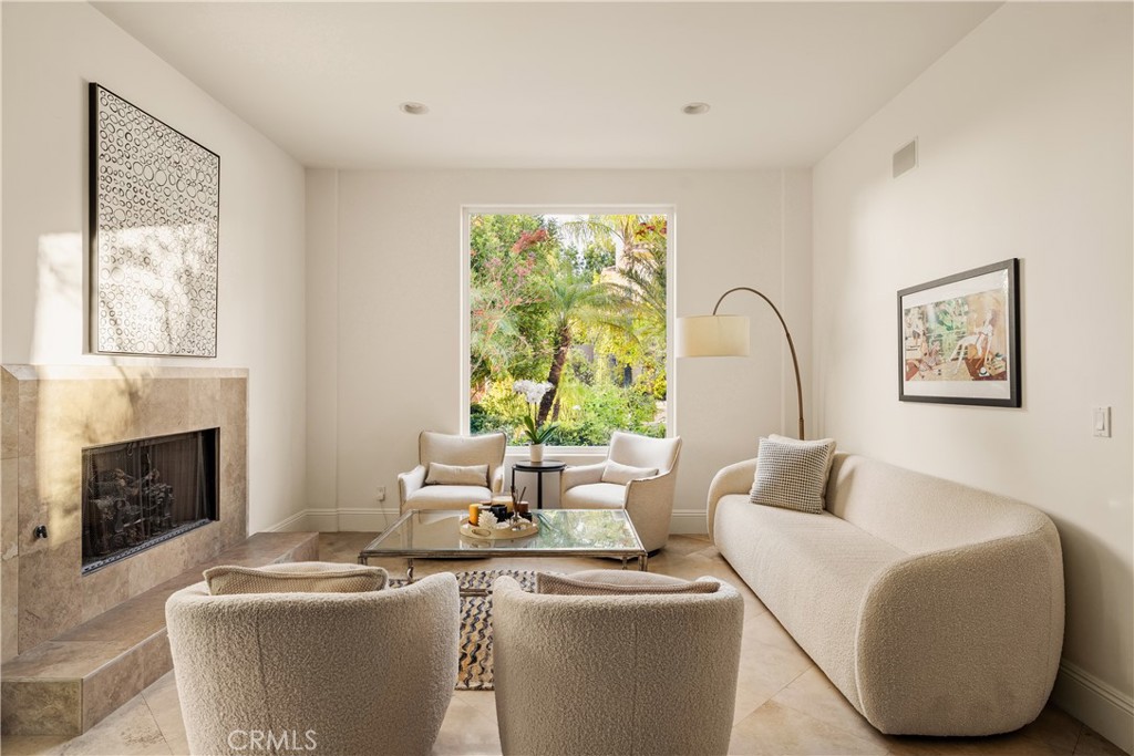 4210 Old Topanga Canyon Road Calabasas, CA 91302 - Photo 4 of 40 a living room with furniture a fireplace and a large window