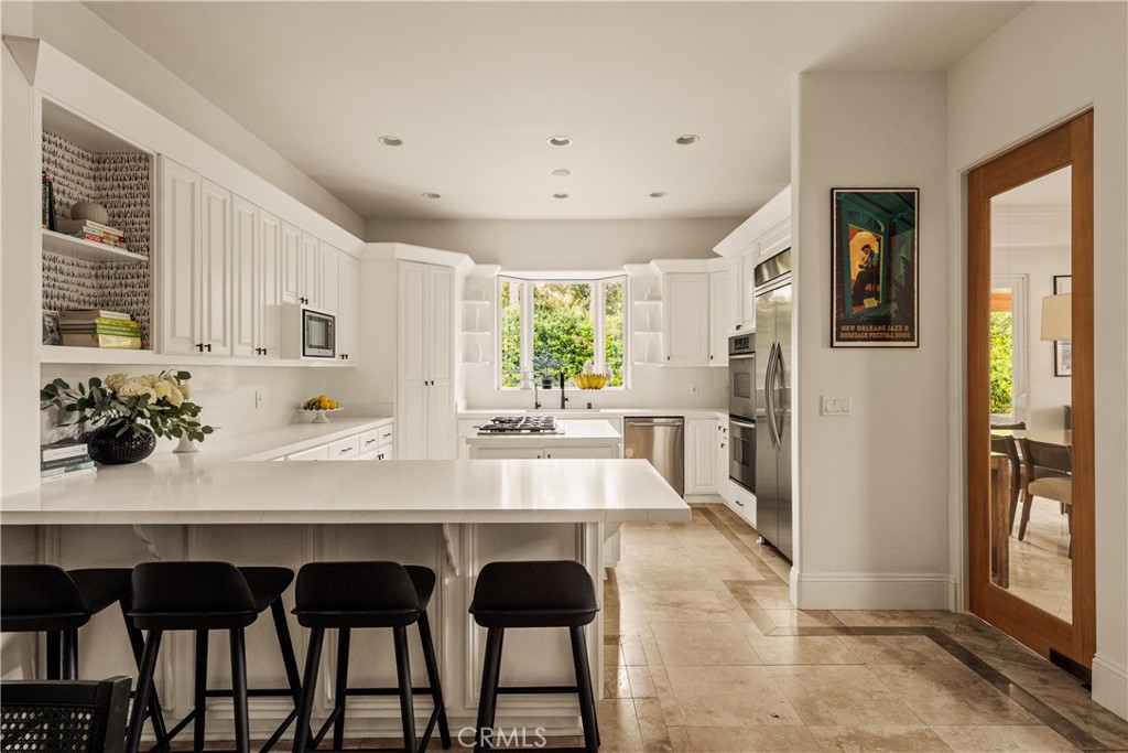 4210 Old Topanga Canyon Road Calabasas, CA 91302 - Photo 8 of 40 a view of a kitchen with granite countertop a table and chairs