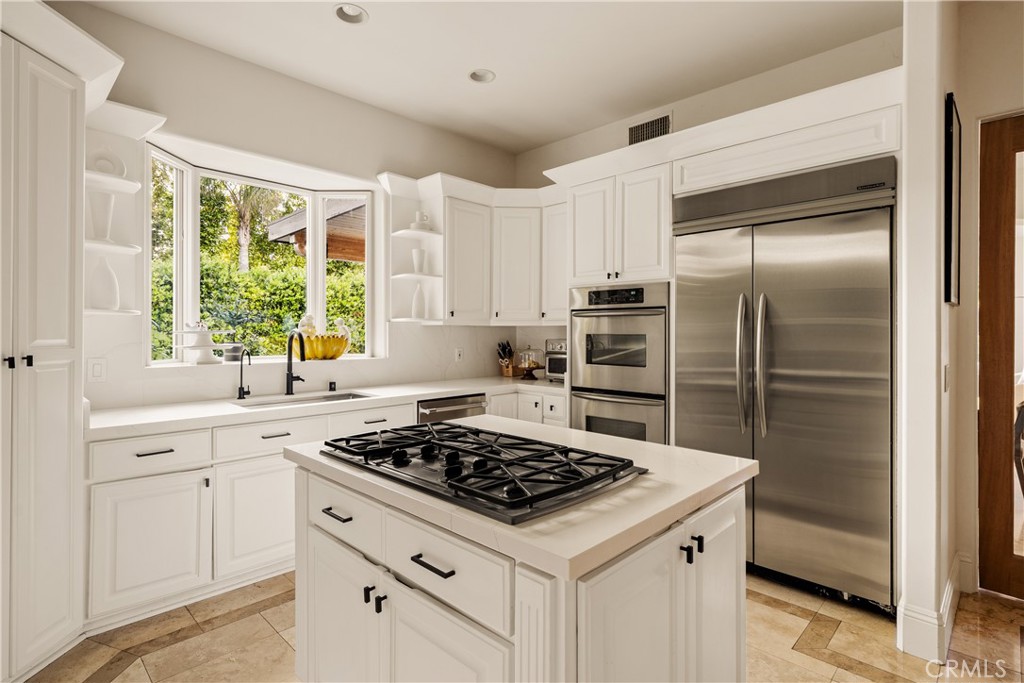 4210 Old Topanga Canyon Road Calabasas, CA 91302 - Photo 10 of 40 a kitchen with a stove a sink and a refrigerator