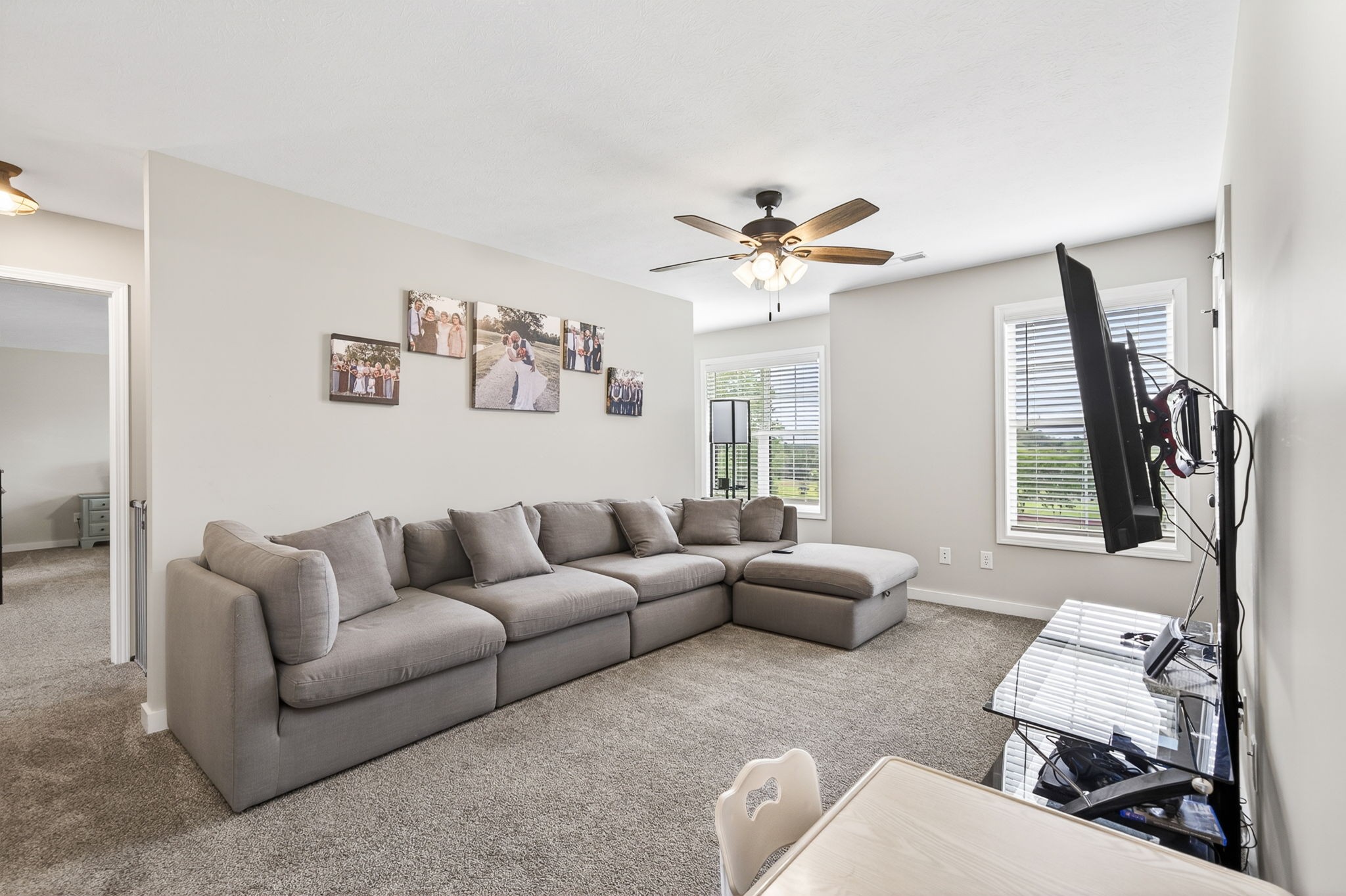 6810 Cherry Creek Road Cookeville, TN 38506 - Photo 12 of 35 a living room with furniture a flat screen tv and a window