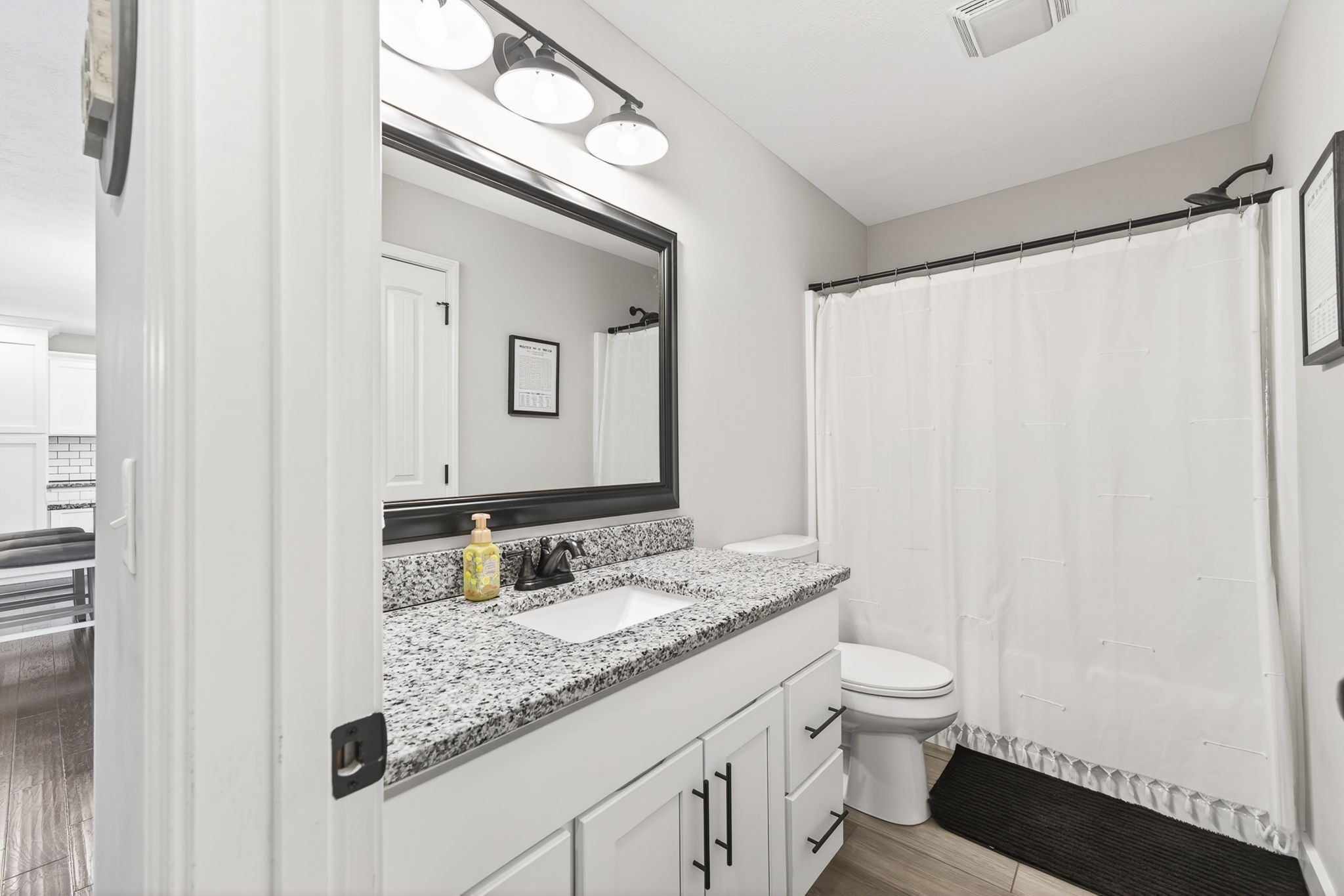 6810 Cherry Creek Road Cookeville, TN 38506 - Photo 17 of 35 a bathroom with a granite countertop sink toilet and shower