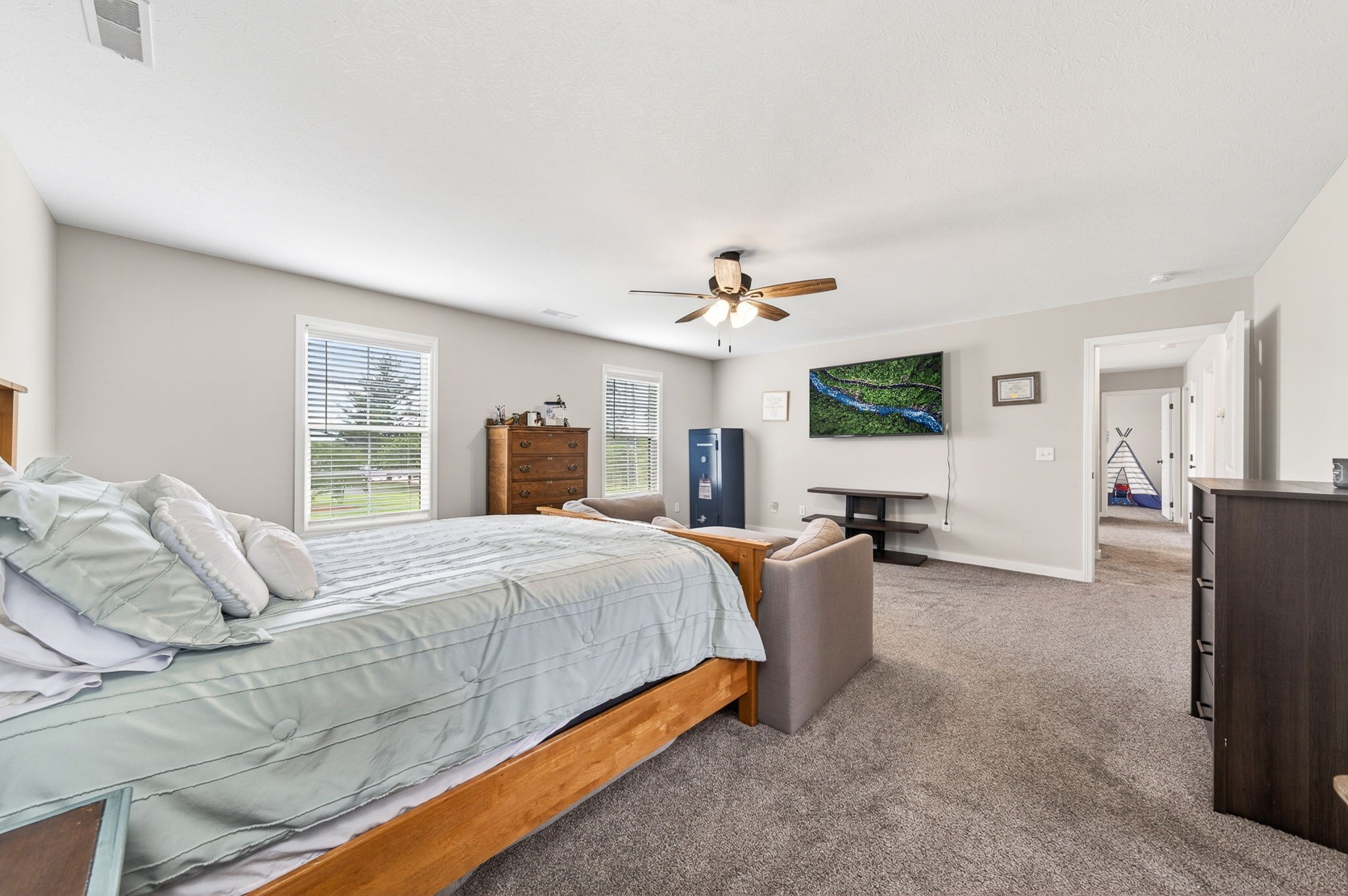6810 Cherry Creek Road Cookeville, TN 38506 - Photo 21 of 35 a bedroom with a bed and flat screen tv