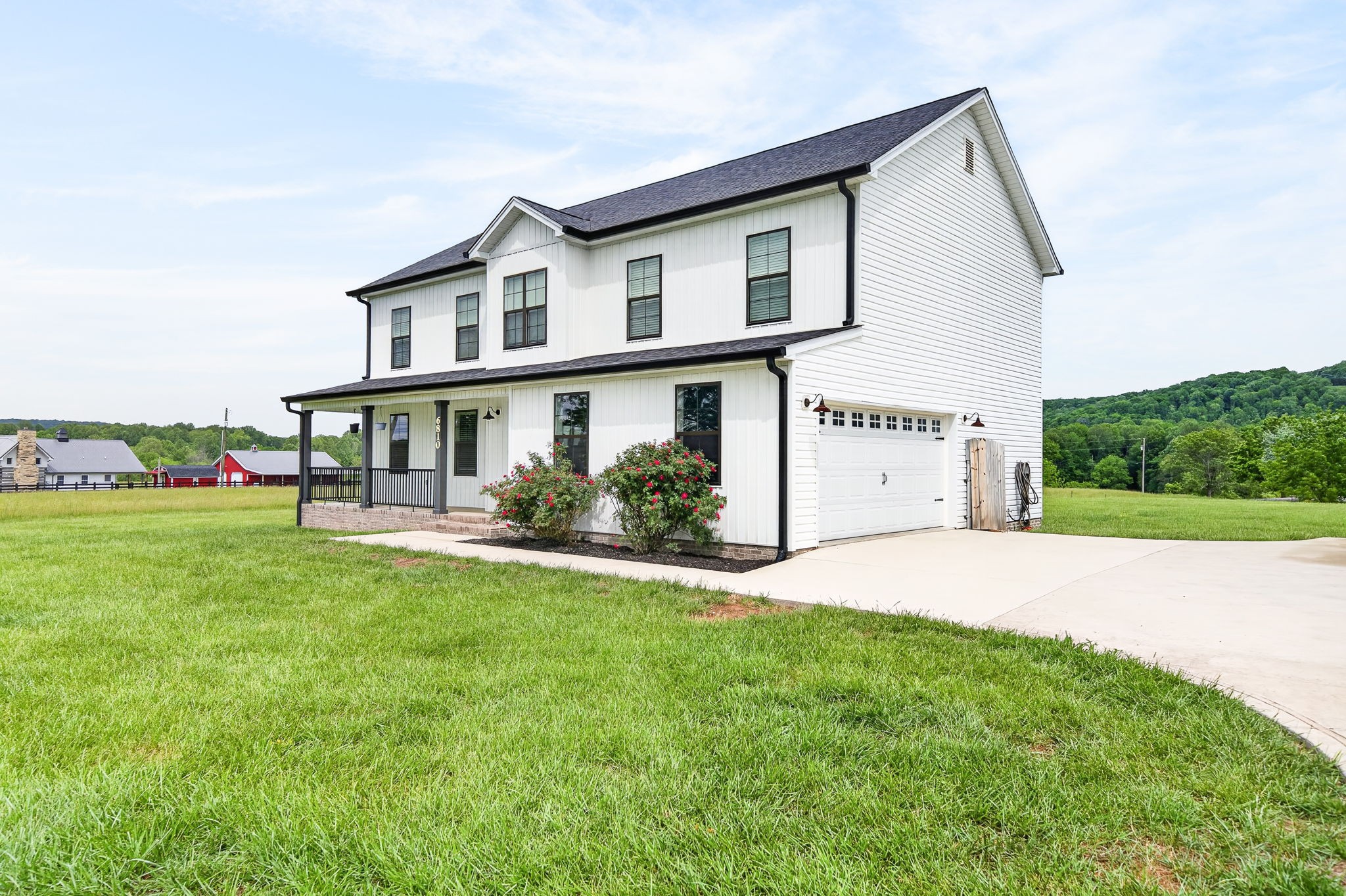 6810 Cherry Creek Road Cookeville, TN 38506 - Photo 26 of 35 a front view of a house with a yard and garage