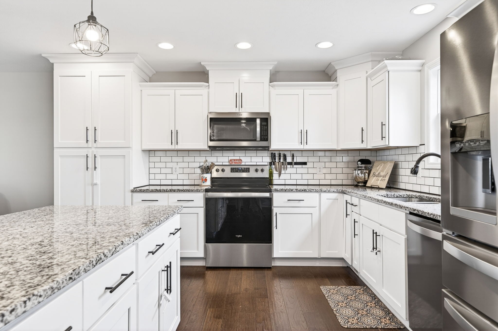 6810 Cherry Creek Road Cookeville, TN 38506 - Photo 5 of 35 a kitchen with granite countertop a sink stainless steel appliances and white cabinets