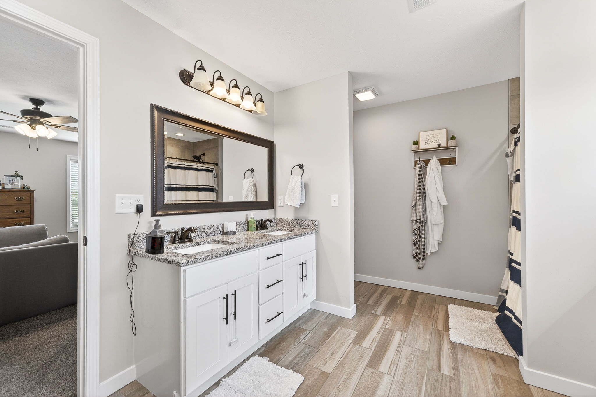 6810 Cherry Creek Road Cookeville, TN 38506 - Photo 10 of 35 a bathroom with a double vanity sink mirror and bathtub