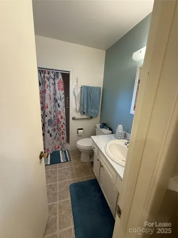 a kitchen with stainless steel appliances granite countertop a stove a refrigerator and a sink