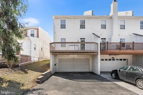 a view of a car park in front of house