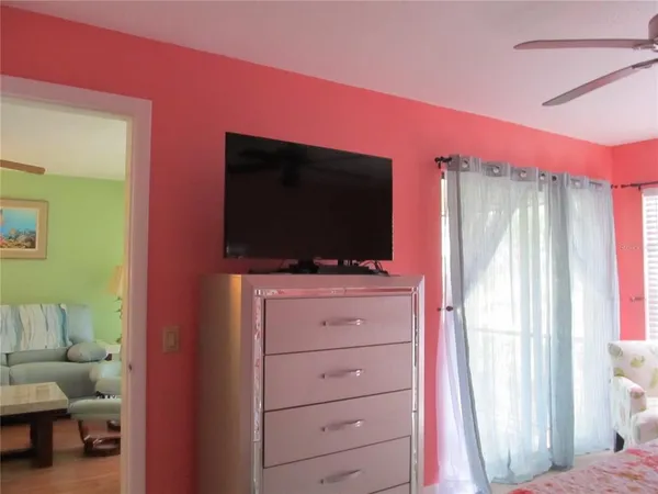 a living room with flat screen tv and furniture