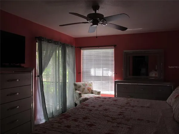 a bedroom with furniture and a window