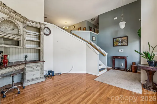 a workspace with furniture staircase and a living room