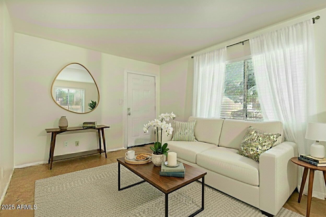 1318 East Culver Street, Unit 1 Phoenix, AZ 85006 - Photo 1 of 26 a living room with furniture and a window