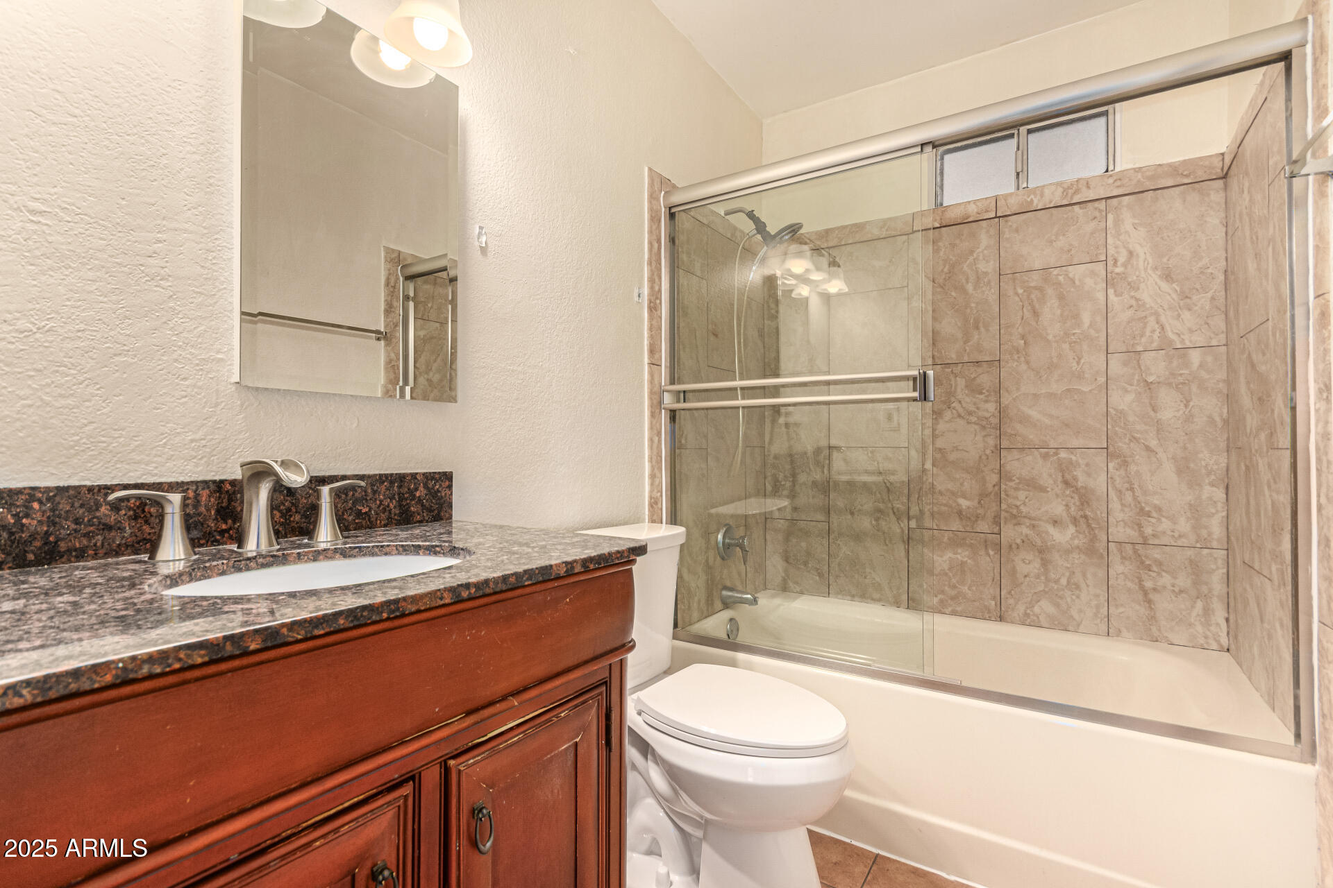 1318 East Culver Street, Unit 1 Phoenix, AZ 85006 - Photo 12 of 26 a bathroom with a sink a toilet and a bathtub