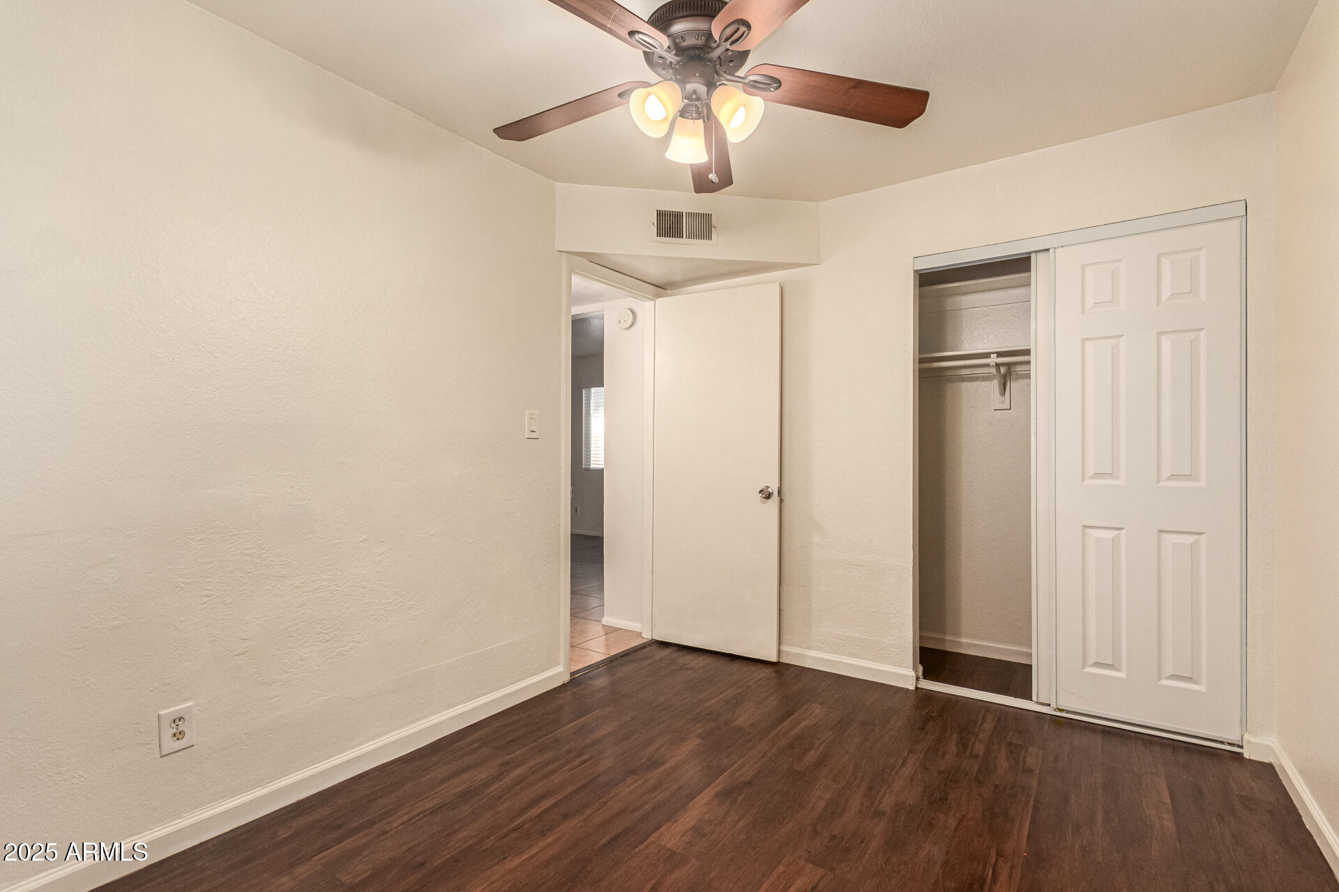 1318 East Culver Street, Unit 1 Phoenix, AZ 85006 - Photo 15 of 26 wooden floor in an empty room with a window