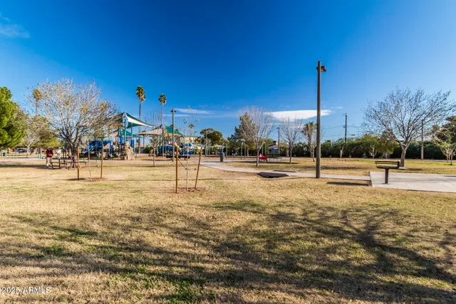 a living room with furniture and a pool table