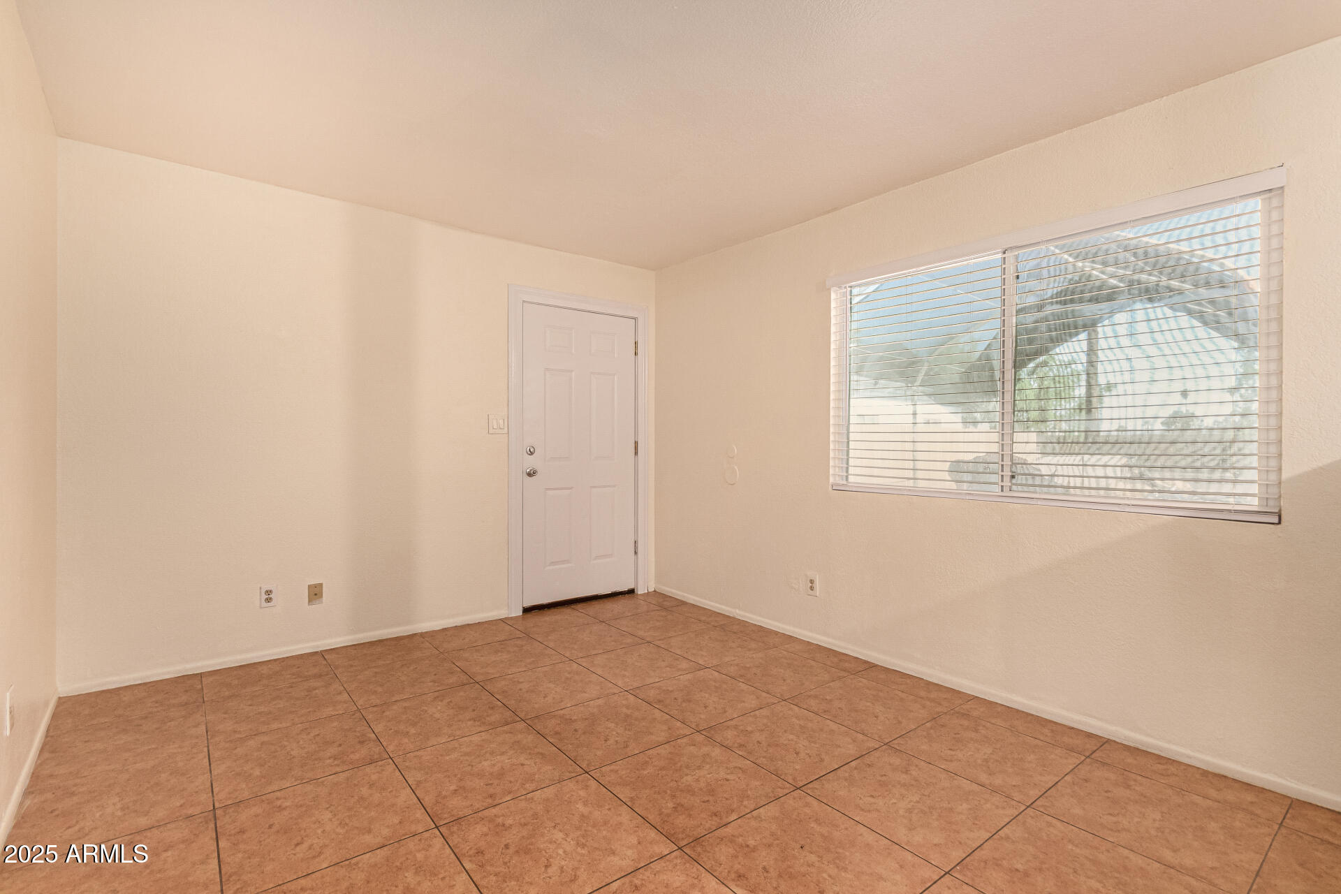 1318 East Culver Street, Unit 1 Phoenix, AZ 85006 - Photo 2 of 26 an empty room with a window