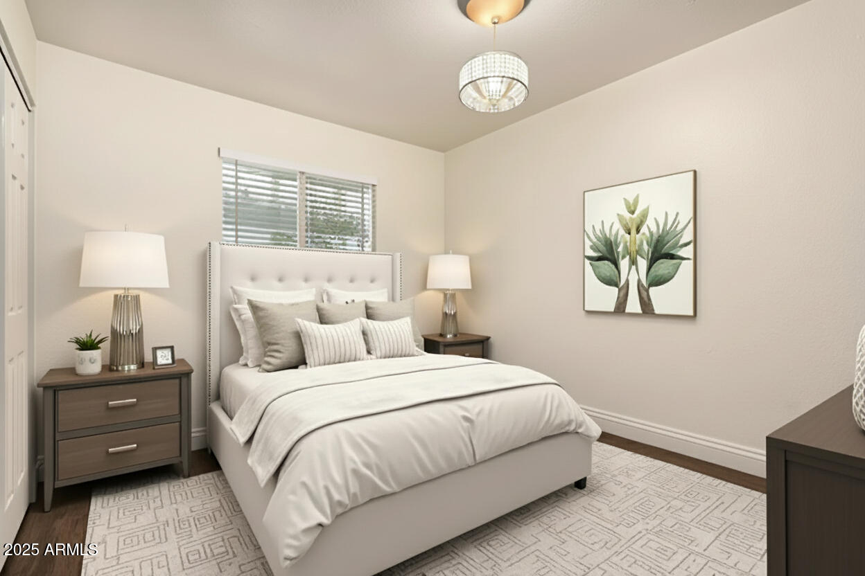 1318 East Culver Street, Unit 1 Phoenix, AZ 85006 - Photo 9 of 26 a bedroom with a bed and a painting on the wall