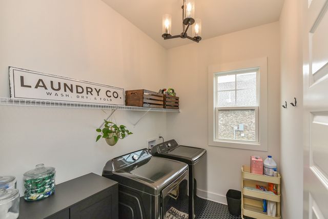 a spacious bathroom with a double vanity sink toilet and shower