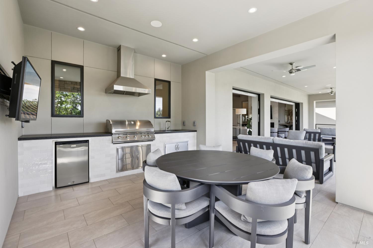 3758 Skyfarm Drive Santa Rosa, CA 95403 - Photo 18 of 80 a kitchen with a table chairs stove and microwave