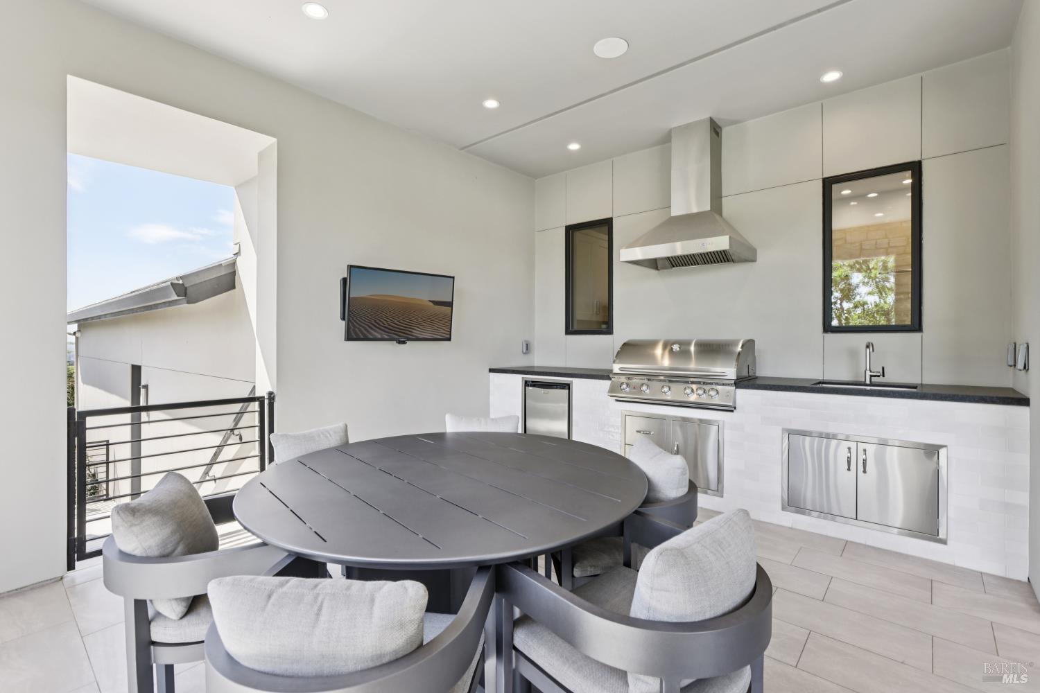 3758 Skyfarm Drive Santa Rosa, CA 95403 - Photo 19 of 80 a kitchen with stainless steel appliances a sink a stove a table and chairs