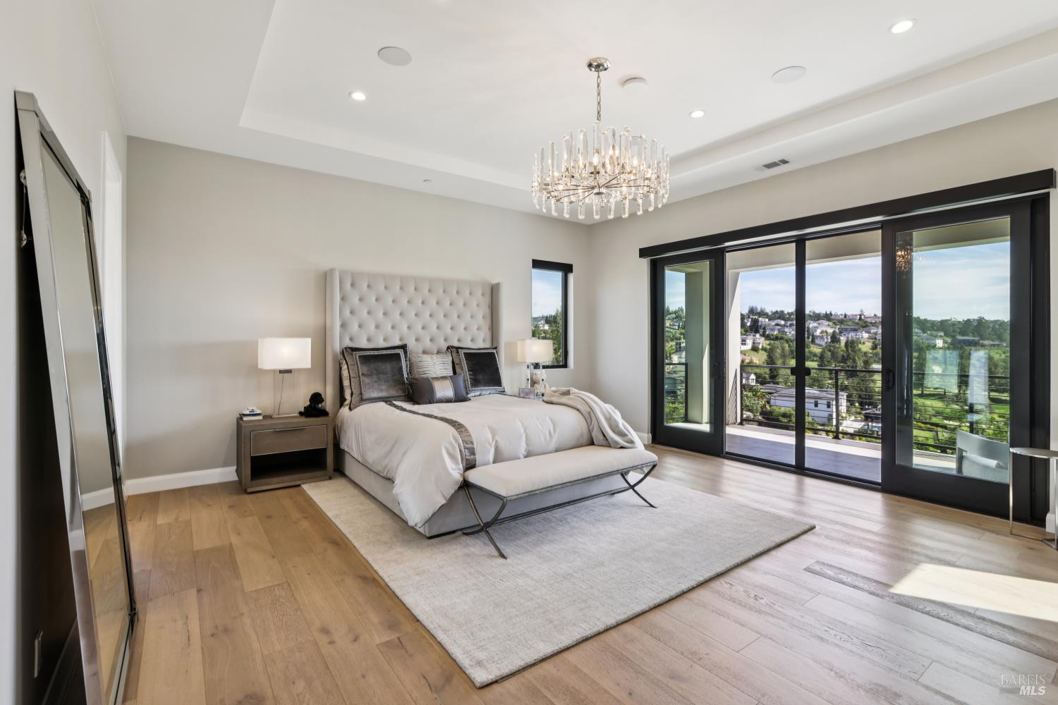 3758 Skyfarm Drive Santa Rosa, CA 95403 - Photo 30 of 80 a spacious bedroom with a large bed and a chandelier