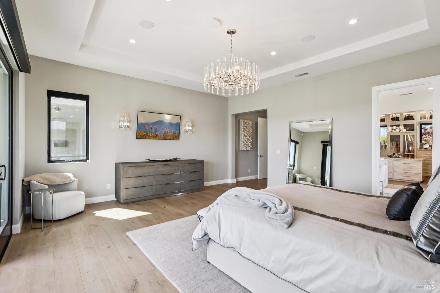 3758 Skyfarm Drive Santa Rosa, CA 95403 - Photo 32 of 80 a bedroom with a bed and a chandelier